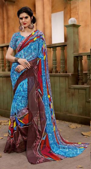 Grab This Pretty Simple Saree For your Casual Wear In Blue Color Paired With Blue Colored Blouse. This Saree And Blouse Are Fabricated On Chiffon Beautified With Abstract Prints All Over It.