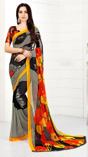 IF Your Are Fond Of Lining Prints, Than Go For This Lovely Saree In Black And White Color Paired With Black And Orange Colored Blouse. This Saree And Blouse Are Fabricated On Chiffon Beautified With Lining And Abstract Prints. Buy This Saree Now.
