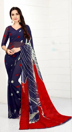 Enhance your Personality Wearing this Lovely Saree In Navy Blue Color Paired With Navy Blue Colored Blouse. This Saree And Blouse Are Fabricated On Chiffon Beautified With Polka Dots Prints. Buy This Saree Now.