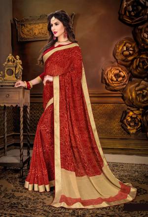 Adorn The Lovely Angelic Lookn Wearing This Saree In Red Color Paired With Red Colored Blouse. This Saree Is Fabricated On Georgette Paired With Art Silk Fabricated Blouse. It Is Beautified With Prints All Over It. Buy This Saree Now.