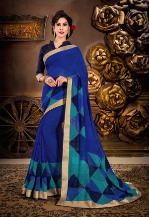 Go With The Shades Of Blue Wearing this Saree In Blue Color Paired With Navy Blue Colored Blouse. This Saree Is Fabricated On Georgette Paired With Art Silk Fabricatee Blouse. It Is Beautified With Geomterical Prints. Buy This Saree Now.