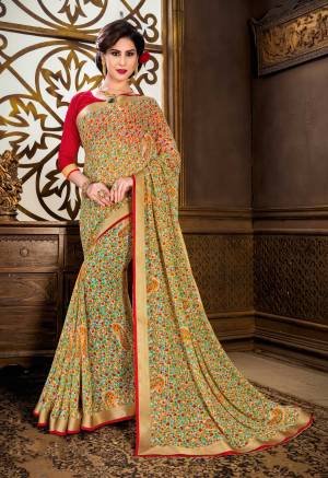 Go Colorful With This Pretty Saree In Multi Color Paired With Red Colored Blouse. This Saree Is Fabricated On Georgette Paired With Art Silk Fabricated Blouse. It Is Beautified With Small Multi Colored Floral Prints All Over. 
