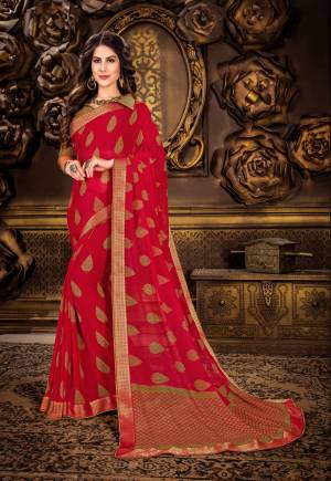 Grab This Pretty Attractive Saree In Red Color Paired With Contrasting Olive Green Colored Blouse. This Saree Is Fabricated On Georgette Paired With Art Silk Fabricated Blouse. It Is Beautified With Block Print Motifs.