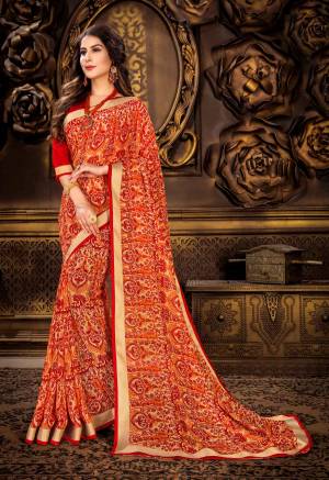 Orange And Color Induces Perfect Summery Appeal To Any Outfit, So Grab This Saree In Orange And Red Color Paired With Contrasting Red Colored Blouse. This Saree Is Fabricated On Georgette Paired With Art Silk Fabricated Blouse. It Is Light In Weight And Easy To Carry All Day Long.