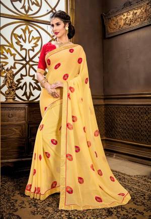 Earn Lots Of Compliments Wearing This Lovely Saree In Yellow Color Paired With Contrasting Red Colored Blouse. This Saree Is Fabricated On Georgette Paired With Art Silk Fabricated Blouse. It Has Pretty Floral Motifs All Over The Saree. Buy Now.