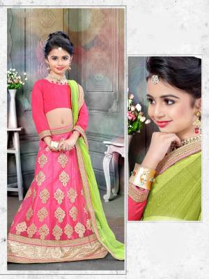 Your Girl Will Definitely Earn Lots Of Compliments With This Pretty Lehenga Choli In Pink Color Paired With Contrasting Light Green Colored Dupatta. Its Blouse Is Fabricated On Art Silk Paired With Net Fabricated Lehenga And Dupatta. Buy This Designer Lehenga Choli Now.