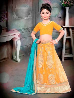 For The Upcoming Festive And Wedding Season, Grab This Designer Lehenga Choli In Musturd Yellow Color Paired With Contrasting Turquoise Blue Colored Dupatta. Its Blouse Is Fabricated On Art Silk Paired With Net Fabricated Lehenga And Dupatta. Buy It Now.