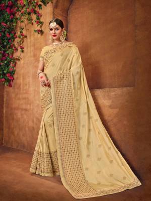 Flaunt a new ethnic look wearing this Cream color two tone silk fabrics saree. this party wear saree won't fail to impress everyone around you. this gorgeous saree featuring a beautiful mix of designs. Its attractive color and designer heavy embroidered design, Flower patch design, beautiful floral design work over the attire & contrast hemline adds to the look. Comes along with a contrast unstitched blouse.