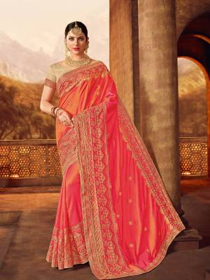 Classy, sensuous and versatile are the perfect words to describe this Pink And red color two tone silk fabrics saree. Ideal for party, festive & social gatherings. this gorgeous saree featuring a beautiful mix of designs. Its attractive color and designer heavy embroidered design, Flower patch design, beautiful floral design work over the attire & contrast hemline adds to the look. Comes along with a contrast unstitched blouse.