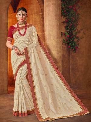 The fabulous pattern makes this off-white color silk fabrics saree. Ideal for party, festive & social gatherings. this gorgeous saree featuring a beautiful mix of designs. Its attractive color and designer heavy embroidered design, Flower patch design, beautiful floral design work over the attire & contrast hemline adds to the look. Comes along with a contrast unstitched blouse.