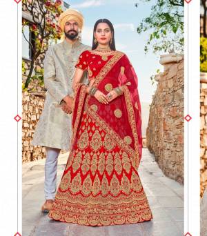 Adorn the Pretty Angelic Look Wearing This Heavy Designer Lehenga Choli In Red Color Paired With Red Colored Dupatta. Its Blouse And Lehenga Are Fabricated On Satin Silk Paired With Net Fabricated Dupatta. It Is Beautified With Heavy Jari Embroidery And Stone Work. Buy This Lehenga Choli Now.