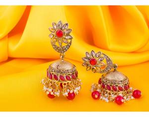 Grab This Beautiful Jumka Styled Earrings In Golden Color Beautified With Red Colored Stone Work. This Earring Set Can Be Paired With Any Contrasting OR Red Colored Ethnic Attire.