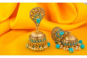 A Very Pretty Pair Of Earrings Is Here With This Jhumka Styled Golden Colored Earrings Beautified With Aqua Blue Colored Stone Work.
