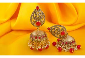 Grab This Beautiful Jumka Styled Earrings In Golden Color Beautified With Red Colored Stone Work. This Earring Set Can Be Paired With Any Contrasting OR Red Colored Ethnic Attire.