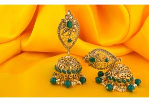 To Enhance Your Traditional Look, Grab This Beautiful Pair Of Earrings In Golden Color Beautified With Green Colored Stones. These Are Light Weight And Easy To Carry Throughout The Gala.