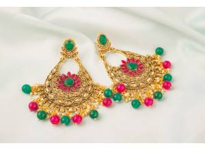 Go Colorful With This Lovely Pair Of Earrings In Golden Color Beautified With Multi Colored Stone Work. Buy This Set Now.