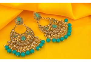 A Very Pretty Pair Of Earrings Is Here With This Heavy Golden Colored Earrings Beautified With Aqua Blue Colored Stone Work.