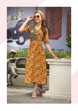 You Will Definitely Earn Lots Of Compliments Wearing This Designer Readymade Kurti In Yellow And Orange Color Fabricated On Rayon Beautified With Multiple Geometric Prints. Buy This Kurti Now.