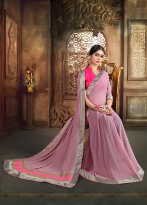 Grab This Lovely Saree In Grey And Pink Color Paired With Pink colored Blouse. This Saree Is Fabricated On Georgette Paired With Art Silk Fabricated Blouse. It Is Beautified with Polka Dots Prints All Over It. Buy This Saree Now.