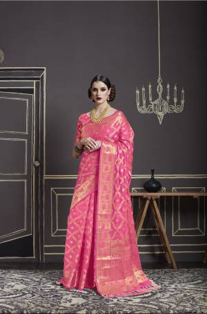 Look Pretty In This Silk In Pink Color Paired With Pink Colored Blouse. This Saree And Blouse Are Fabricated On Nylon Art Silk Beautified With Weave All Over It And Tassels Over The Pallu. This Saree Is Light Weight And Easy To Carry All Day Long.