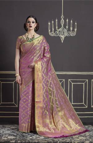 Earn Lots Of Compliments Wearing This Saree In Light Pink Color Paired With Light Pink Colored Blouse. This Saree And Blouse Are Fabricated On Nylon Art Silk Beautified With Weave All Over. Buy This Saree Now.