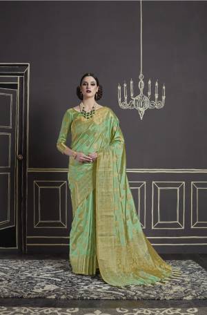 Add This Pretty Saree To Your Wardrobe In Light Green Color Paired With Light Green Colored Blouse. This Saree And Blouse Are Fabricated On Nylon Art Silk Beautified With Weave All Over It And Tassels Over The Pallu.