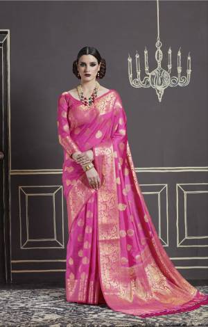 Here Is An Attractive Shade In Pink With This Sareee In Rani Pink Color Paired With Rani Pink Colored Blouse. This Saree And Blouse Are Fabricated On Nylon Art Silk Beautified With Weave All Over It.