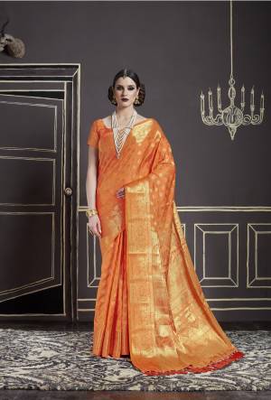 Orange Color Induces Perfect Summery Appeal To Any Outfit, So Grab This Saree And Look Attractive Of All In Orange Color Paired With Orange Colored Blouse. This Saree And Blouse Are Fabricated On Nylon Art Silk Beautified With Weave All Over It.