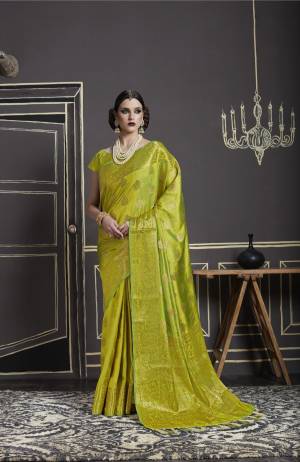 New And Unique Shade In Green Is Here With this Saree In Pear Green Color Paired With Pear Green Colored Blouse. This Saree And Blouse Are Fabricated On Nylon Art Silk Beautified With Weave All Over And Tassels Over The Pallu.