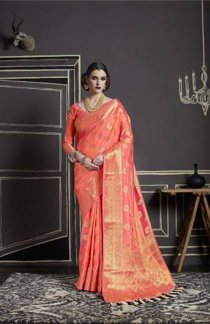 Celebrate This Festive Season Wearing This Saree In Dark Peach Color Paired With Dark Peach Colored Blouse. This Saree And Blouse Are Fabricated On Nylon Art Silk Beautified With Weave All Over It. It Has Great Shine And Luster In Fabric. Buy This Saree Now.