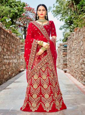 Adorn The Beautiful Angelic Look Wearing This Designer Lehenga choli In Red Color Paired With Red Colored Dupatta. Its Blouse And Lehenga Are Fabricated On Velvet Paired With Net Fabricated Dupatta. This Lehenga Choli Is Beautified With Heavy Jari And Thread Work All Over It. Buy This Now And You Will Definitely Earn Lots Of Compliments Wsaring This Lehenga Choli.