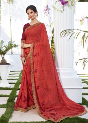 For Your Semi-Casual Or Casual Wear, Grab This Saree In Red Color Paired With Maroon Colored Blouse. This Saree And Blouse Are Fabricated On Georgette Beautified With Minimum Prints All Lace Border.