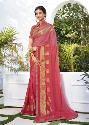 A Must Have Color In Every Womens Wardrobe Is Here With This Saree In Pink Color Paired With Pink Colored Blouse. This Saree Is Fabricated On Chiffon Jacquard Paired With Brocade Fabricated Blouse. Buy This Saree Now.