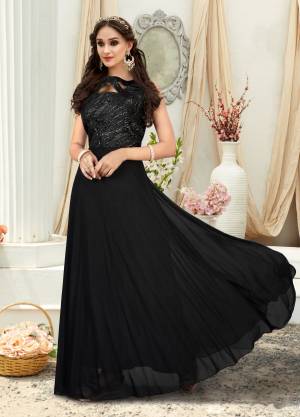 Enhance Your Beauty Wearing This Designer Floor Length Gown In Black Color Fabricated On Fancy Fabric. This Gown Has Beautiful Glittery Yoke Which Will Earn You Lots Of Compliments From Onlookers.