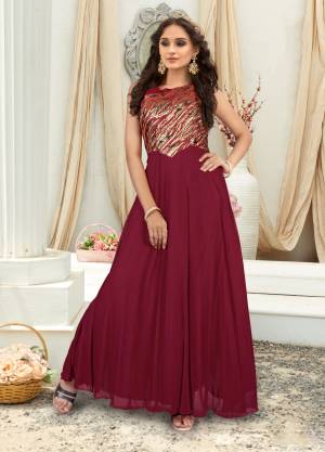 For a Rich And Royal Look, Grab This Designer Floor Length Gown In Maroon Color Fabricated On Fancy Fabric Beautified With Fancy Yoke Pattern. Buy This Redymade Gown Now.