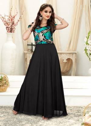 Enhance Your Beauty Wearing This Designer Floor Length Gown In Black Color Fabricated On Fancy Fabric. This Gown Has Beautiful Glittery Yoke Which Will Earn You Lots Of Compliments From Onlookers.