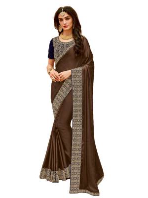 Add This New And Unique Shade To Your Wardrobe In Designer Saree. This Lovely Saree In In Light Brown Color Paired With Contrasting Navy Blue Colored Blouse. This Saree Is Fabricated On Satin Silk Paired With Velvet Fabricated Blouse. It Is Light Weight And Easy To Carry Thoughtout The Gala.