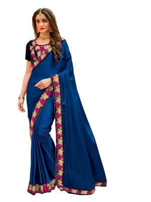 Shine Bright Wearing This Saree In Royal Blue Color Paired With Navy Blue Colored Blouse. This Saree Is Fabricated On Satin Silk Paired With Velvet Fabricated Blouse. It Has Contrasting Embroidery Over The Blouse And Lace Border.
