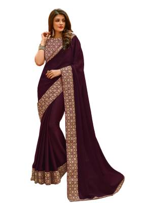 A Must Have Shade In Every Womens Wardrobe Is Here With This Designer Wine Colored Saree Paired With Wine Colored Blouse. This Saree Is Fabricated On Satin Silk Paired With Velvet Fabricated Blouse. It Has Attractive Embroidery Over The Blouse And Lace Border. Buy Now.