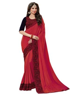 Adorn The Pretty Angelic Look Wearing This Saree In Red Color Paired With Contrasting Navy Blue Colored Blouse. This Saree Is Fabricated On Satin Silk Paired With Velvet Fabricated Blouse. It Is Beautified With Thread Embroidery And Stone Work .