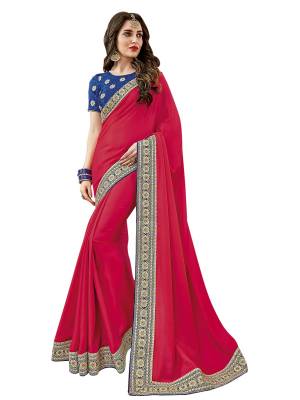 Bright And Visually Appealing Color Is Here With This Designer Saree In Dark Pink Color Paired With Contrasting Royal Blue Colored Blouse. This Saree Is Fabricated On Satin Silk Paired With Art Silk Fabricated Blouse. It Has Heavy Embroidered Lace Border And Embroidered Blouse. 