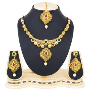 For A Proper Traditional Look, Grab This Necklace Set In Golden Color Beautified With Multi Colored Stone Work. Buy This Set Now.