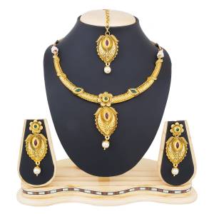 Simple And Elegant Looking Necklace Set Is Here In Golden Color With Earrings And Maang Tika. This Necklace Set Can Be Paired With Any Colored Traditional Attire.