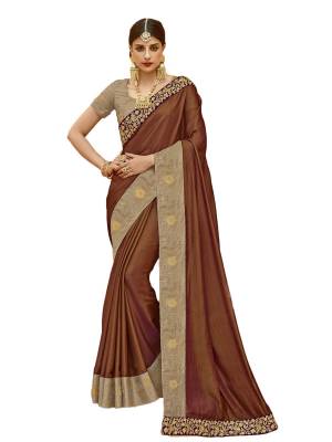 For  A Rich And Elegant Look, Grab This Designer Saree In Brown Color Paired With Beige Colored Blouse, This Saree Is Fabricated On Art Silk Paired With Jacquard Silk Fabricated Blouse. It Is Beautified With Embroidered Lace Border. Buy Now.