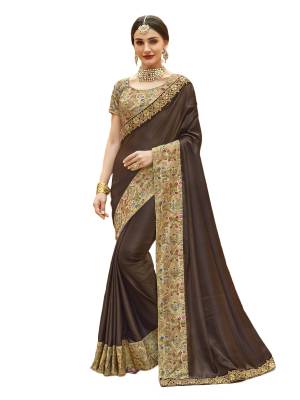 For  A Rich And Elegant Look, Grab This Designer Saree In Brown Color Paired With Beige Colored Blouse, This Saree Is Fabricated On Art Silk Paired With Art Silk Fabricated Blouse. It Is Beautified With Embroidered Lace Border. Buy Now.