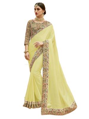 Celebrate This Festive Season Wearing This Designer Saree In Light Yellow Color Paired With Beige Colored Blouse. This Saree Is Fabricated On Satin Silk Paired With Art Silk Fabricated Blouse. Buy This Simple And Elegant Looking Saree In Pretty Color Now.