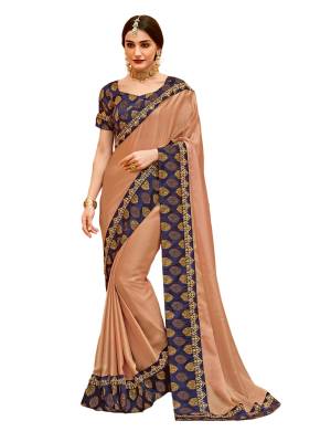 Flaunt Your Rich and Elegant Taste Wearing This Designer Saree In Beige Color Paired With Contrsting Navy Blue Colored Blouse, This Saree Is Fabricated On Satin Silk Paired With Jcquard Silk Fabricated Blouse. Wear This At The Next Party Or Festive. 