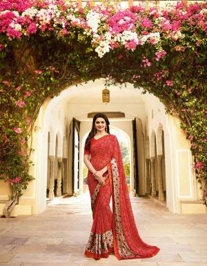 Adorn The Pretty Angelic Look Wearing This Saree In Red Color Paired With Red Colored Blouse. This Saree Is Fabricated On Georgette Paired With Art Silk Fabricated Blouse. It Is Beautified With Prints All Over. Buy Now.