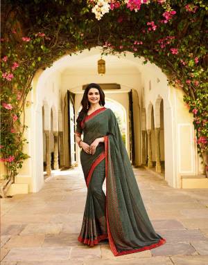 Rich And Elegant Looking Saree Is Here In Dark Grey Color Paired With Dark Grey Colored Blouse. This Saree Is Fabricated On Georgette Paired With Art Silk Fabricated Blouse. This Saree Is Beautified With Prints All Over. Buy Now.