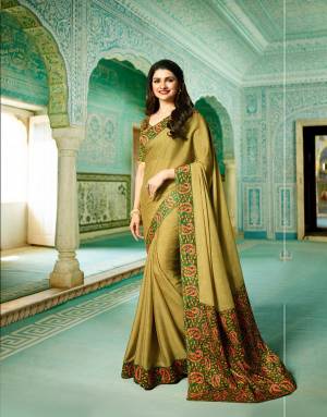 New And Unique Shade In Green Is Here To Add Up Into Your Ethnic Wardrobe, Grab This Saree In Olive Green Color Paired With Green Colored Blouse, This Saree Is Fabricated On Georgette Paired With Art Silk Fabricated Blouse, It Is Beautified With Prints Over The Blouse And Saree Lace BOrder.